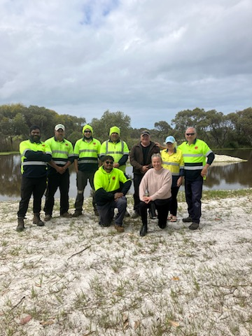 A group of farmers posing on for their Follow the Flowers initiative