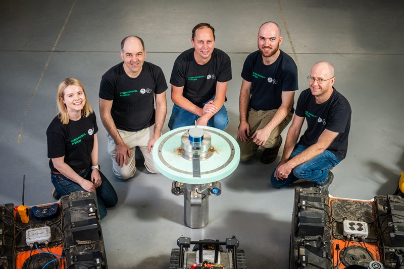 Rosie and the team with their robotic device for monitoring spent nuclear fuel