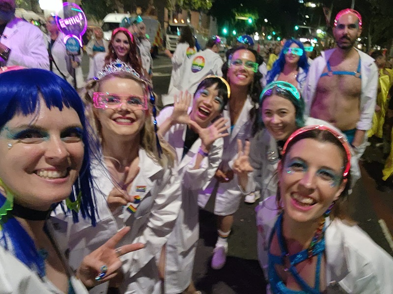 A selfie of Rosie and CSIRO colleagues covered in glitter and costumes during the 2023 Mardi Gras march in Sydney