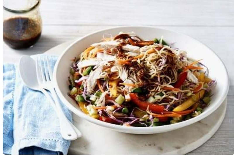 A colourful chicken chow mein salad with lots of cabbage and other veggies. 