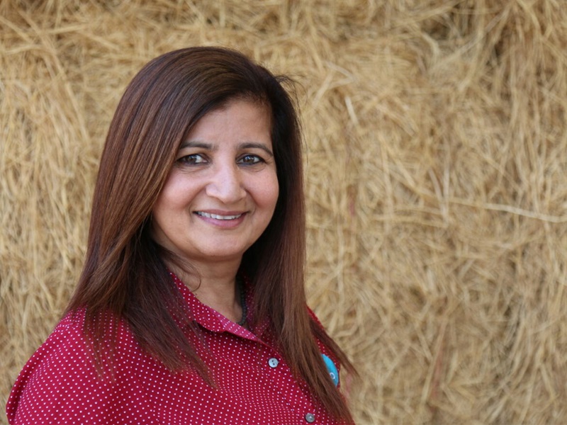 Dr Aarti Tobin has auburn hair and is smiling at the camera