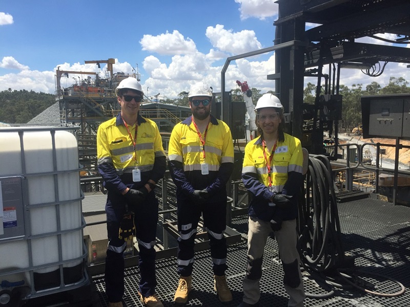 Three men in hi-vis work gear