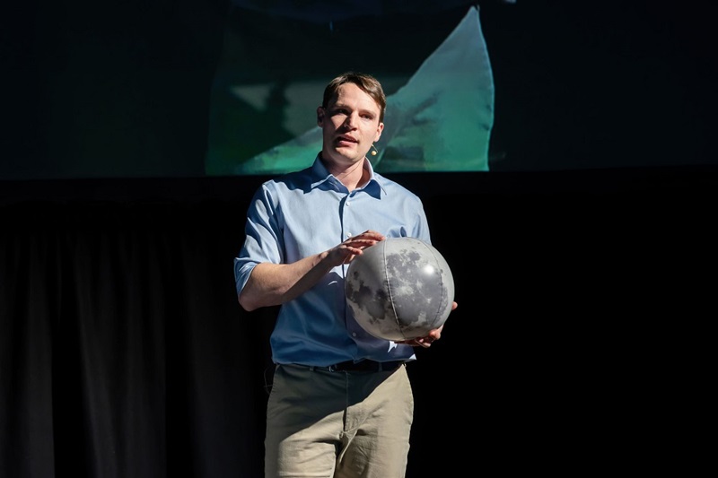 Man holding globe of Moon
