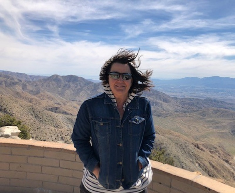 Woman against a mountainous backdrop
