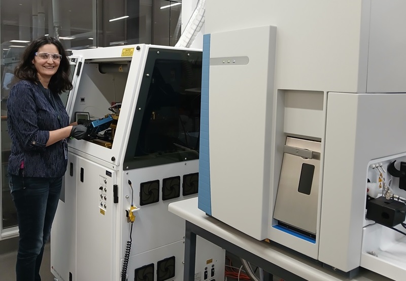 Woman using a Laser Ablation Inductively Coupled Plasma Mass Spectrometer