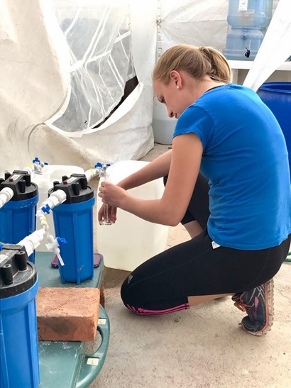 Dr Sarah Hartman collecting water samples and data as part of an agricultural research project.