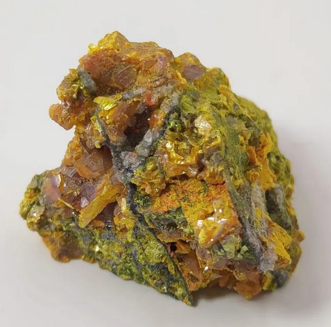 Rock showing prominent yellow-gold crystals