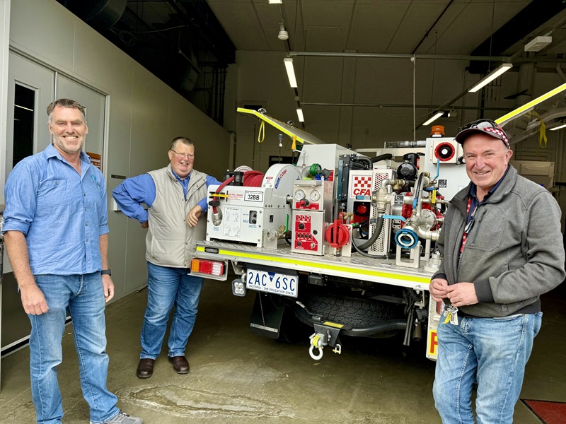 From left to right, Justin Leonard with Country Fire Authority officers Peter Hill and Andrew Webb standing next to the ultra-light-tanker with the new crew cabin system. 
