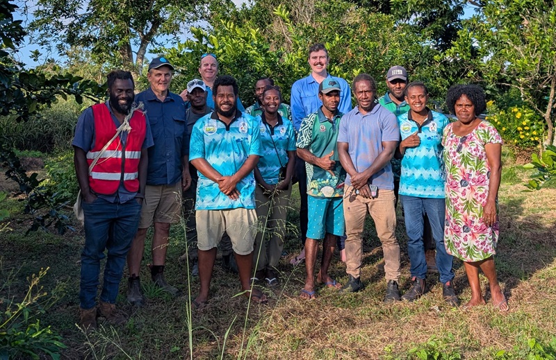 A group photo of CSIRO researchers and members of Pacific Island partners smiling and posing for the camera.