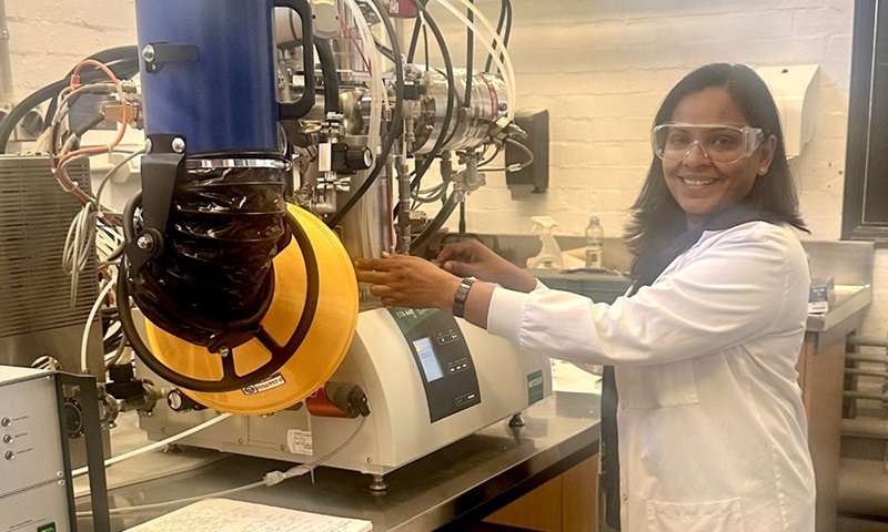 Female scientist working with equipment in lab