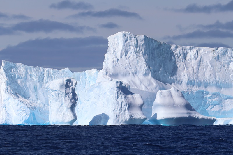 A close up view of an iceberg at sea.