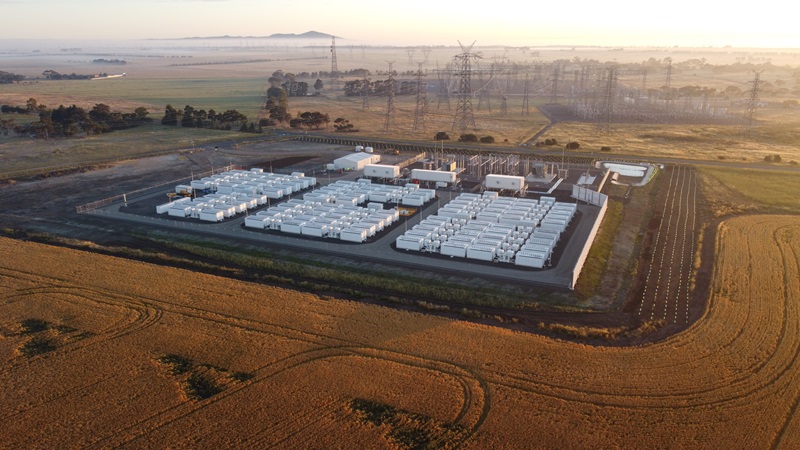 oblique aerial view of industrial battery site in rural setting at dawn