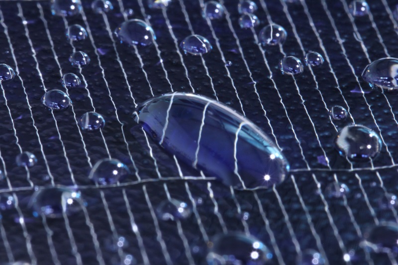 Water droplet pooling on a Solar Panel, close up.