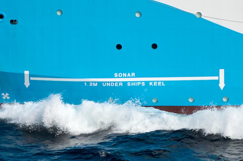A ship's hull with a marking on it showing the location of the ship's sonar system beneath the waterline.