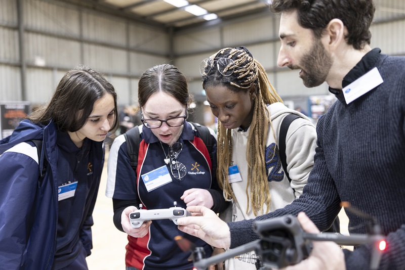 Students at the #WithSTEMYouCan Careers Expo checking out drone technology.