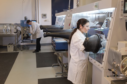 Woman working in battery prototyping facility