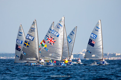 Groups of sailing boats on the water.