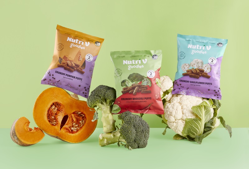 Packets of Nutri V snacks with the vegetables they are made out of – pumpkin, broccoli and cauliflower.