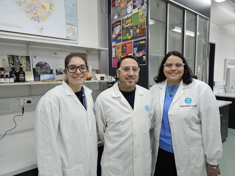 Three CSIRO staff members posing for a photograph outside and in front of one of CSIRO's office buildings