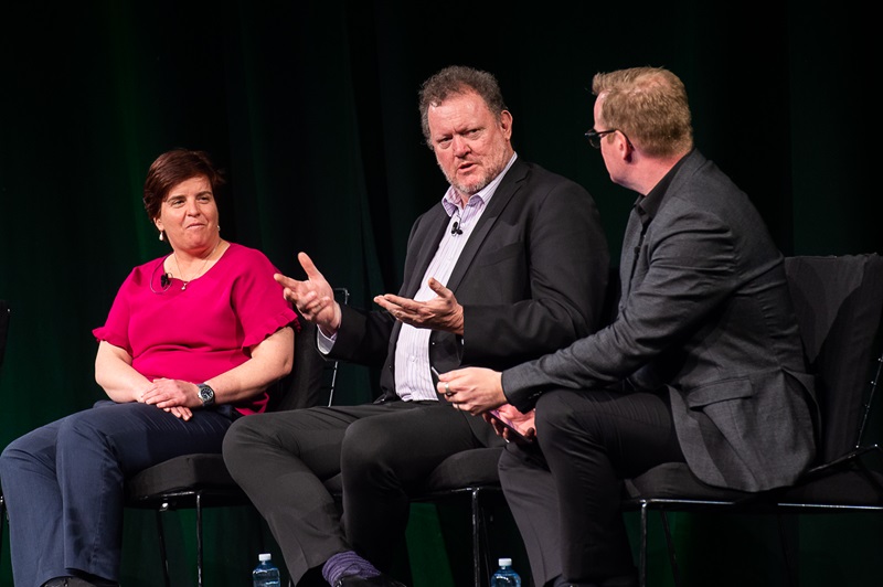 Three people on stage