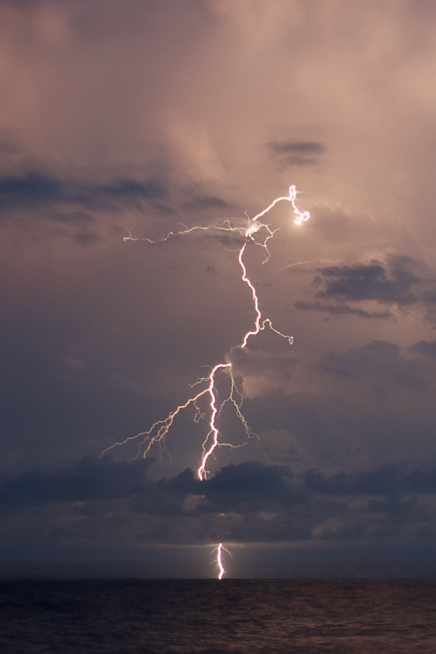 A lightning strike over the ocean.