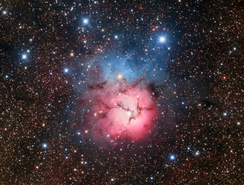A colourful image of stars in the nights sky.