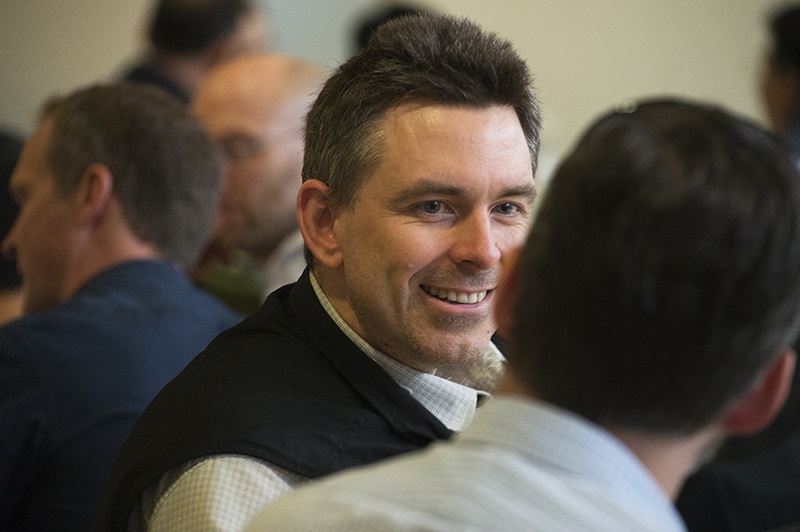 Dr John Ward smiling indirectly at the camera