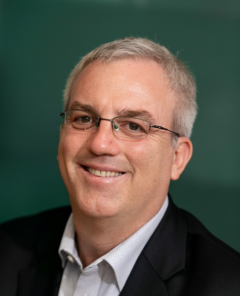 Man smiling at the camera. Health tech solutions. 