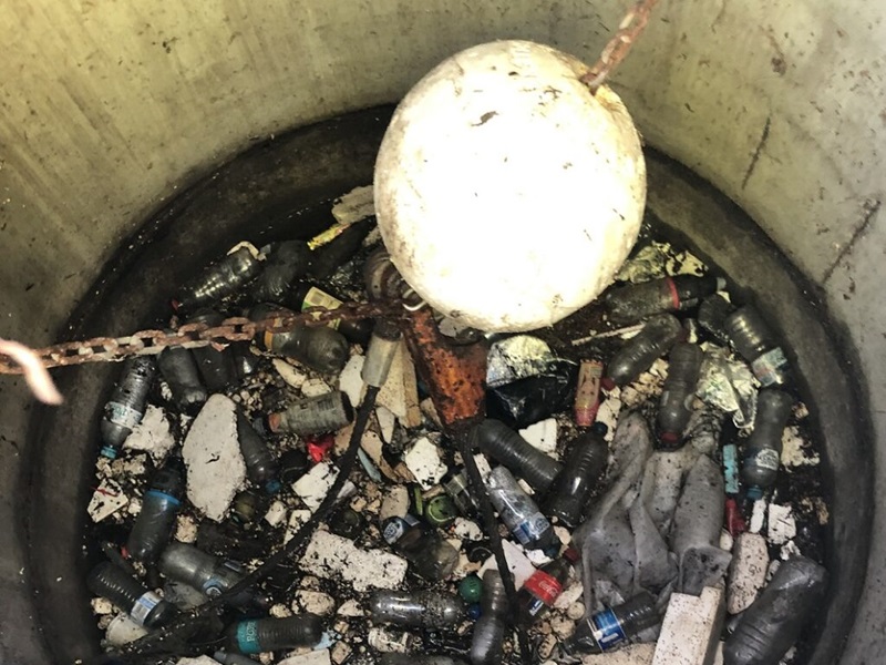 Rubbish in a concrete hole