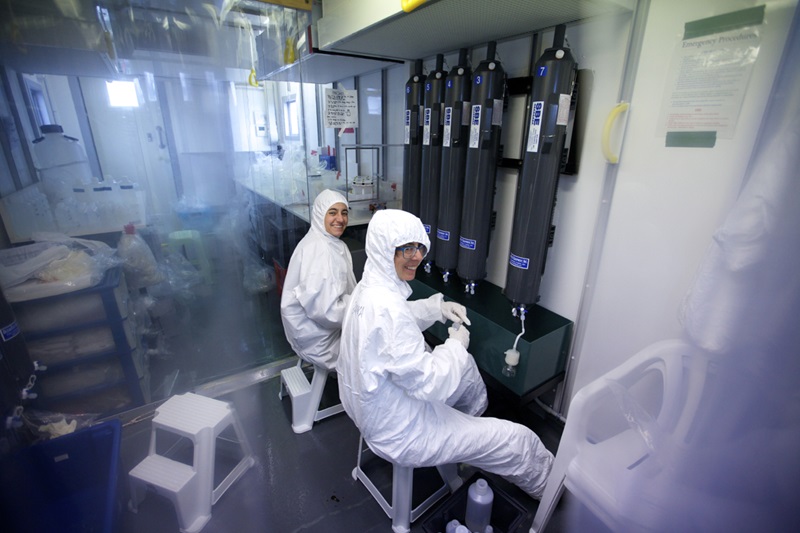 two scientists in hazmat looking at anaemic oceans