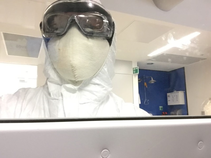 Dr Jurg Schutz wearing a lot of PPE in a lab.