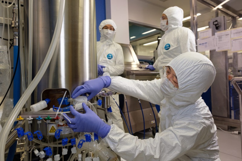 Our team in full PPE working on the COVID-19 vaccine candidate.