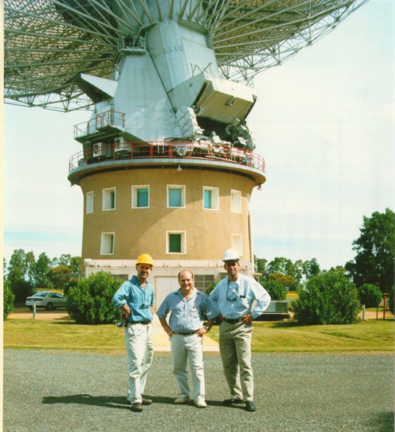Three members of the crew from The Dish movie standing in front of the Parkes radio telescope.