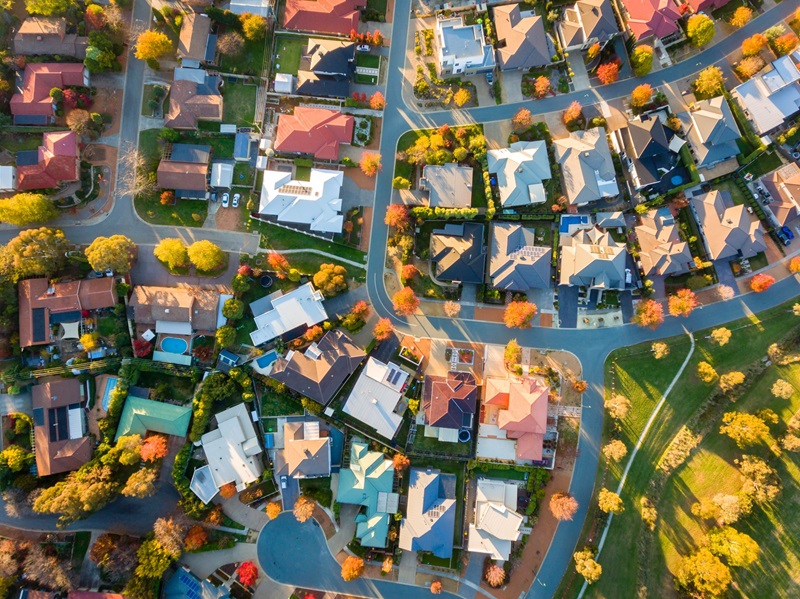 A drone shot of a suburb of houses.