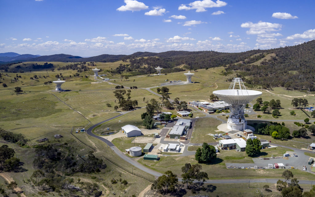 An aerial photograph showing a landscape with various satellites where james webb tracking occurs
