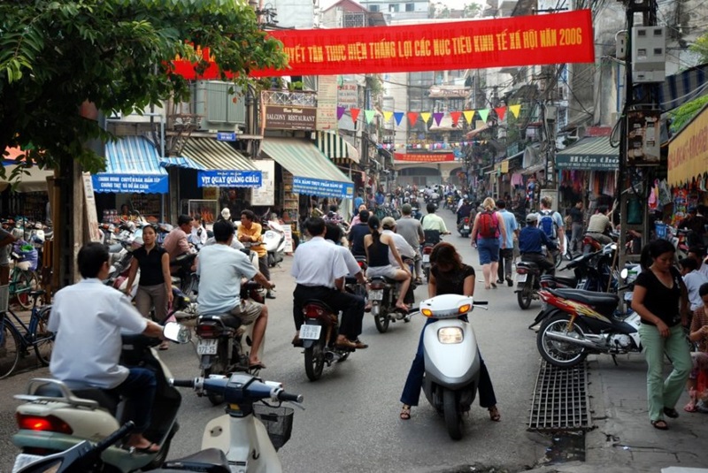 people on motorbikes in hanoi, vietnam
