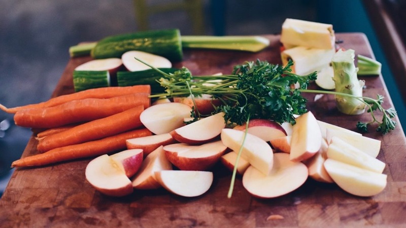 An array of cut up fruit and vegetables.