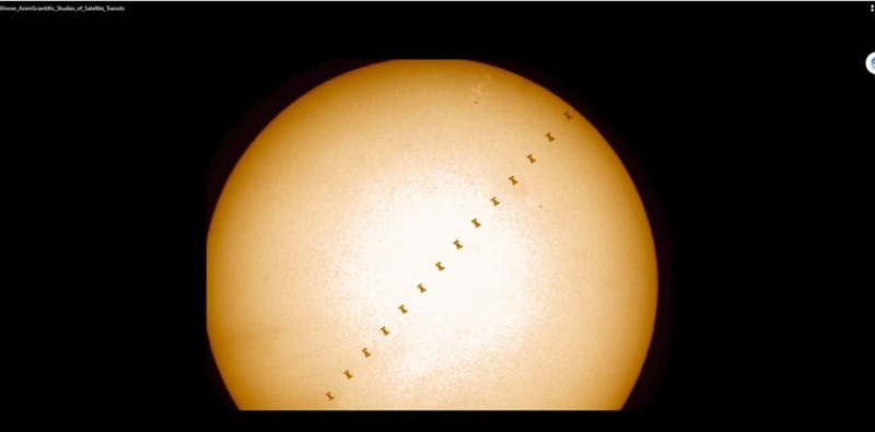 A time-lapse astrophotography image tracking a satellite moving across a planet.