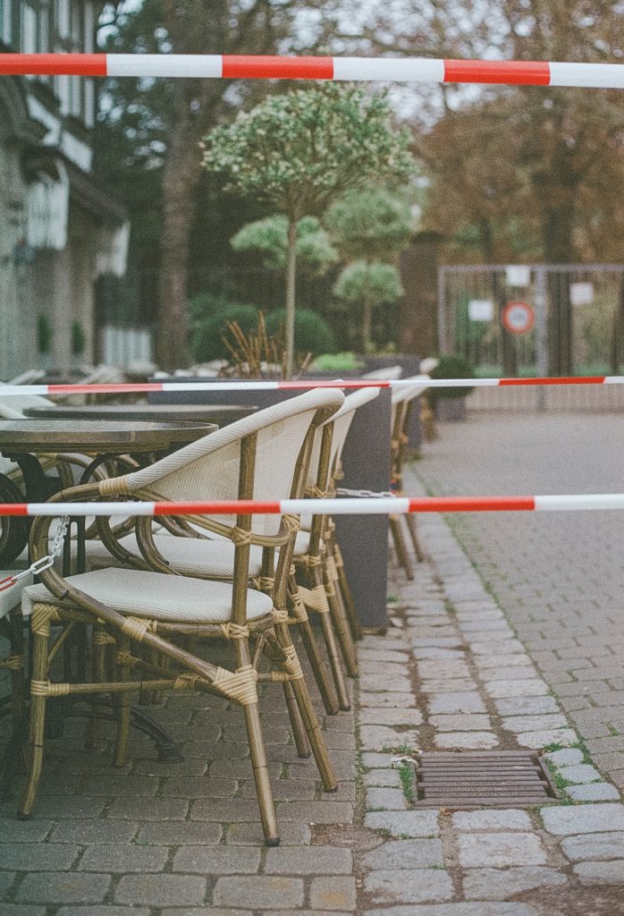 Closed cafe with empty chairs outside