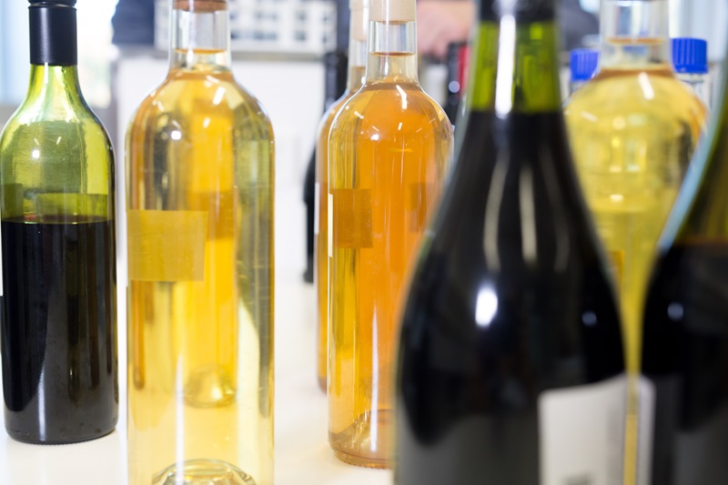 white and red wine bottles close up