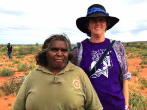 Close up of two women with red desert backdrop