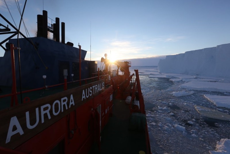 Ship next to glacier