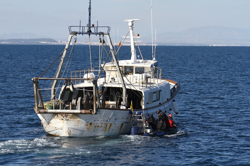 fishing boat with inspector boat