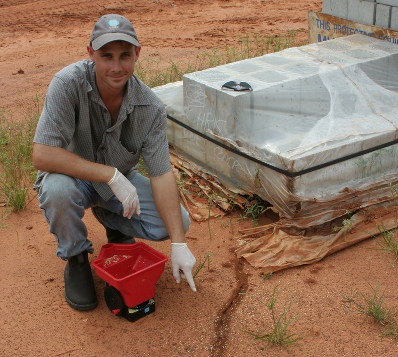 A man pointing to an ant track