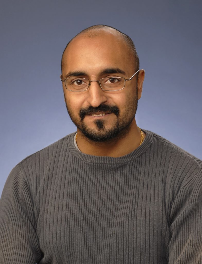 Head and shoulders portrait of Dr Anand Bhatt