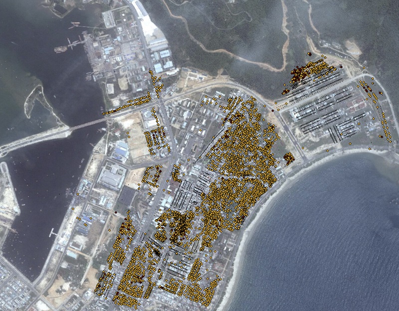 Aerial view of city with yellow spots in some areas