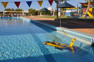 Yellow submarine on the surface of a school pool