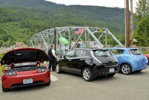 cars at a fast charging electric vehicle station