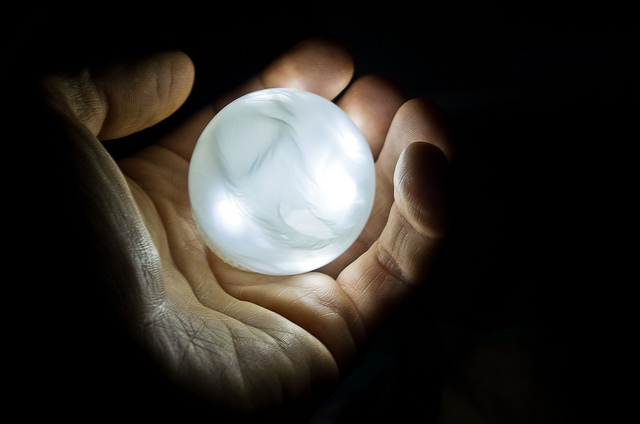 hand with glowing globe