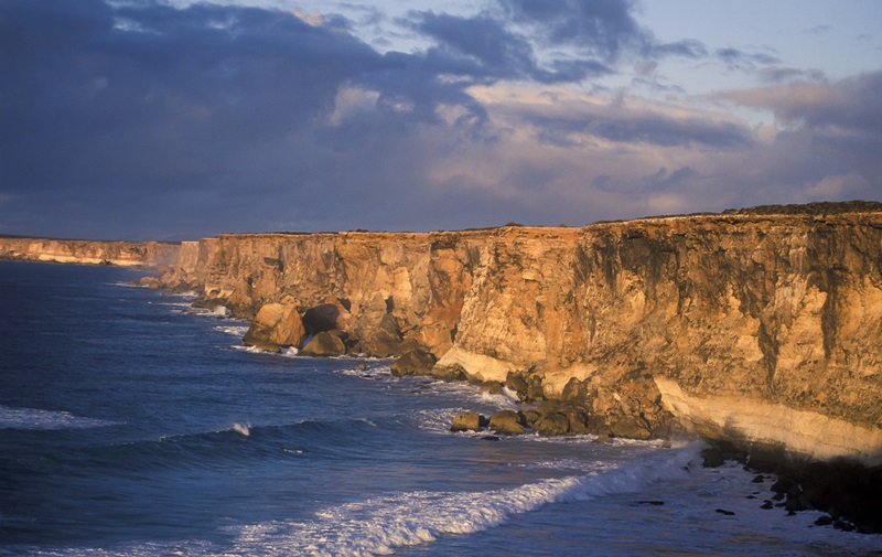 ocean cliffs at sunset
